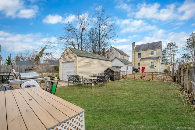 a view of a backyard with sitting area