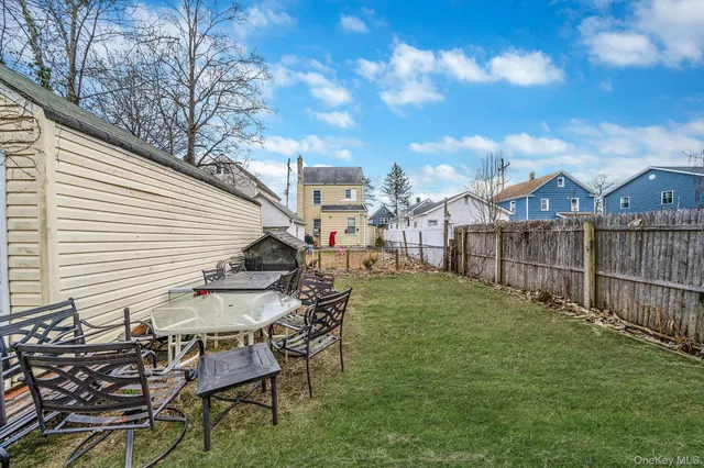 a view of a chairs and table in the yard