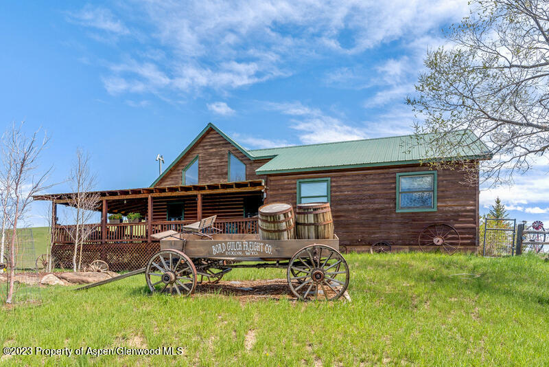 a view of a house with backyard porch and sitting area