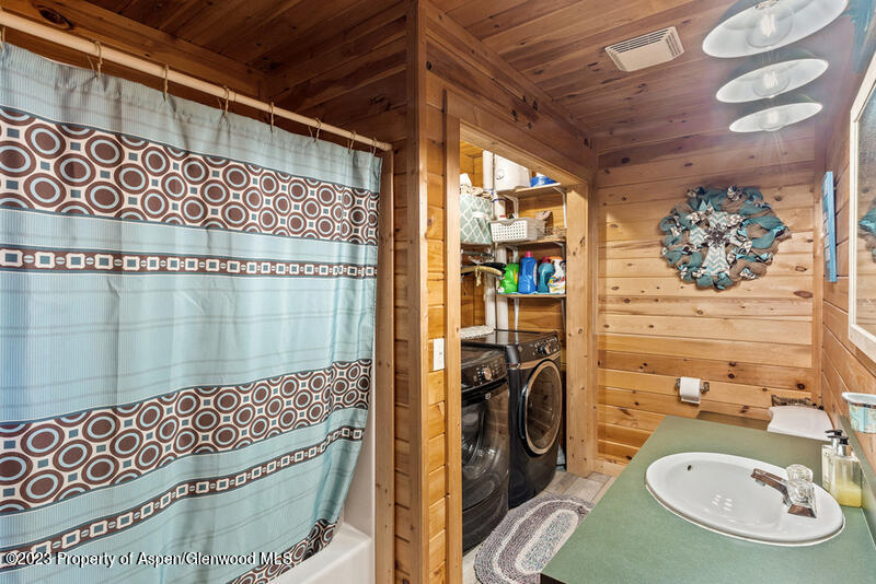 334 County Road 178 Craig, CO 81625 - Photo 11 of 19 a bathroom with a sink a mirror and shower