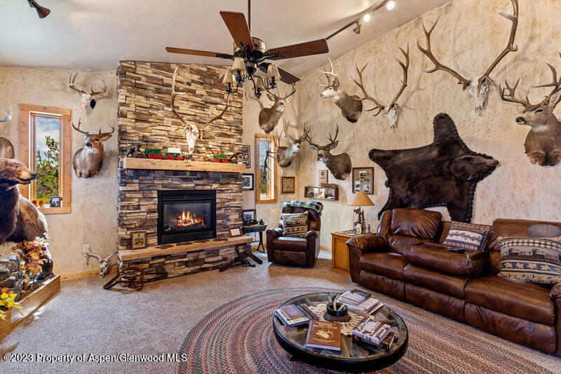 334 County Road 178 Craig, CO 81625 - Photo 12 of 19 a living room with furniture and a fireplace