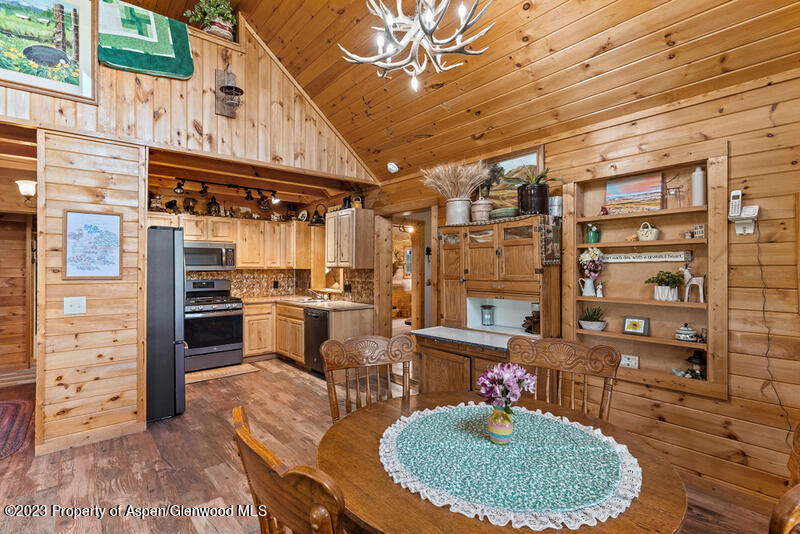 334 County Road 178 Craig, CO 81625 - Photo 6 of 19 a kitchen with cabinets and chairs