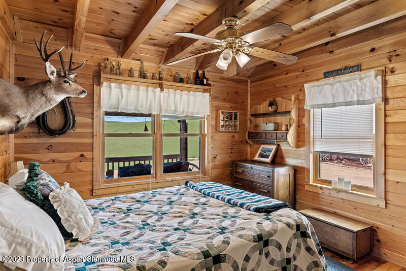 334 County Road 178 Craig, CO 81625 - Photo 9 of 19 a bedroom with a bed and wooden floor