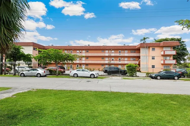 a view of a parked cars in front of a building