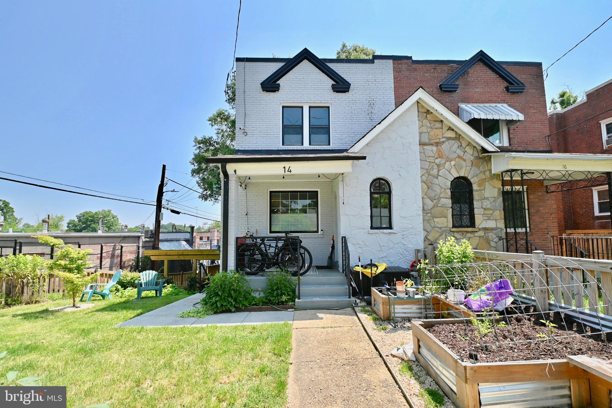 14 53rd Street Southeast Washington, DC 20019 - Photo 1 of 46 a front view of a house with garden