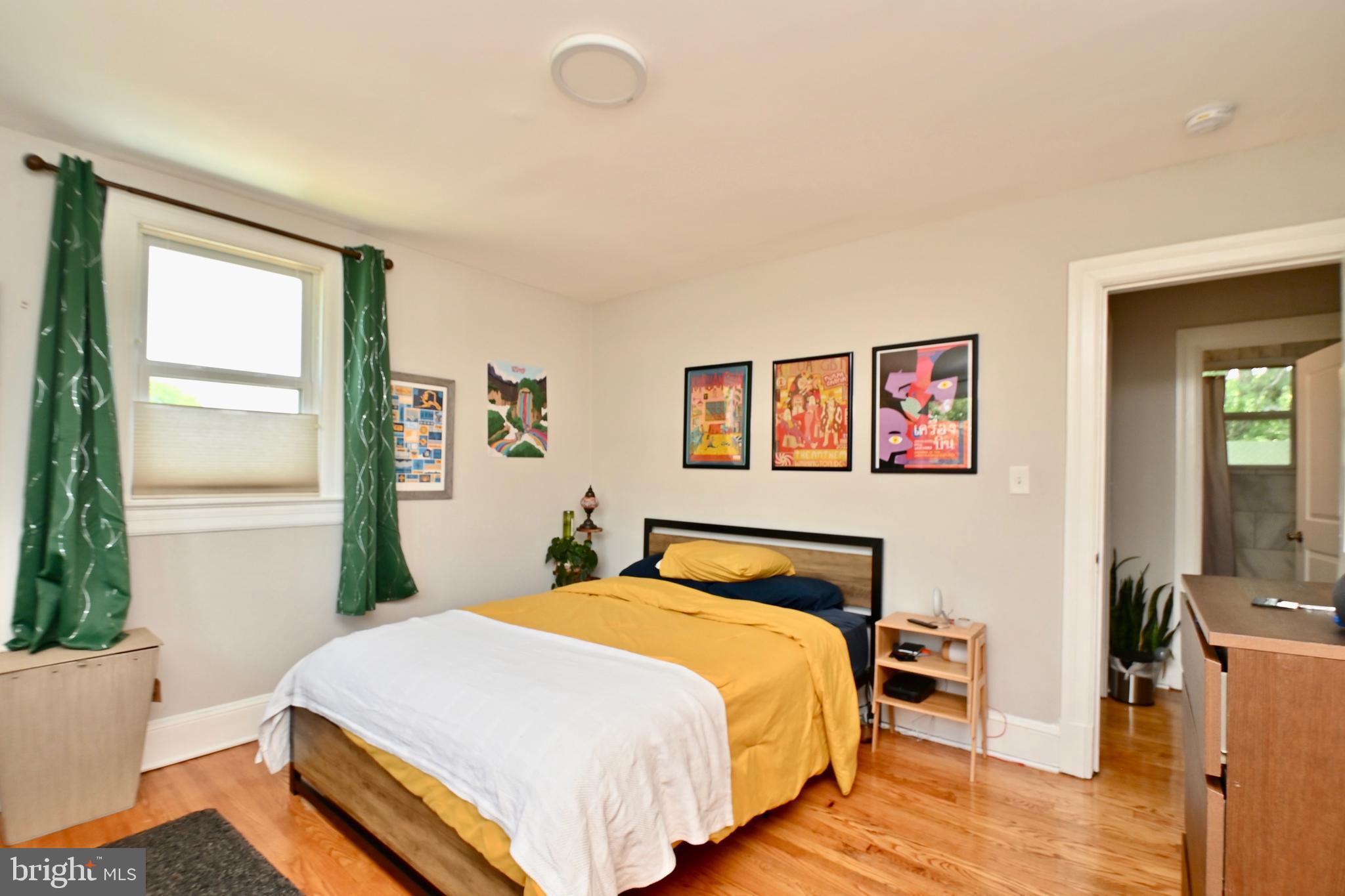 14 53rd Street Southeast Washington, DC 20019 - Photo 14 of 46 a bedroom with a bed and wooden floor