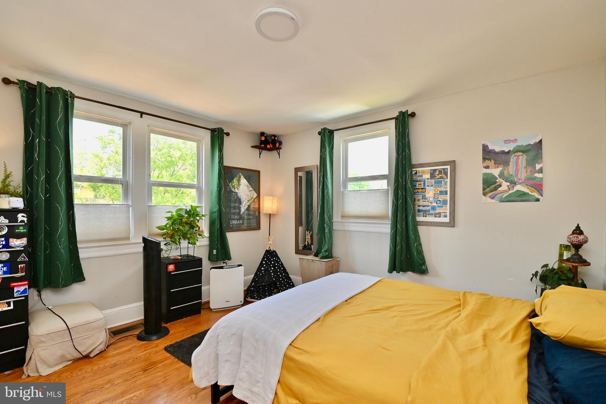 14 53rd Street Southeast Washington, DC 20019 - Photo 16 of 46 a bedroom with a bed and large windows