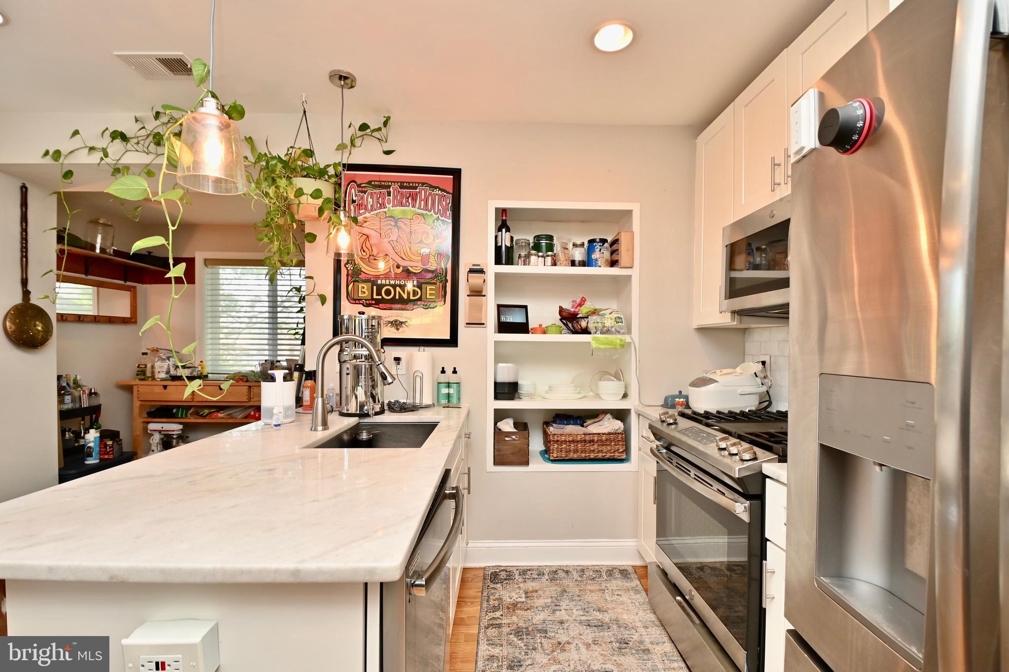 14 53rd Street Southeast Washington, DC 20019 - Photo 22 of 46 a kitchen with stainless steel appliances granite countertop a refrigerator and a stove top oven