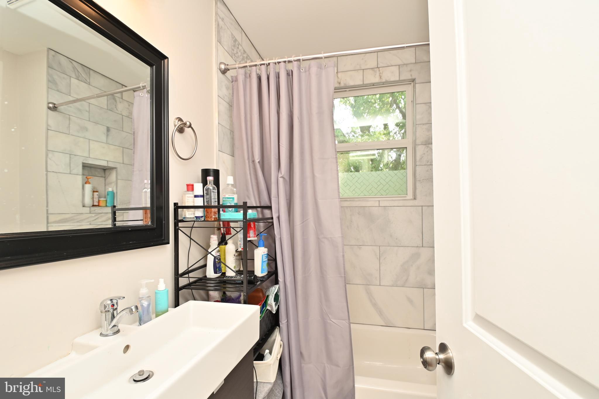 14 53rd Street Southeast Washington, DC 20019 - Photo 26 of 46 a bathroom with a bathtub and a sink