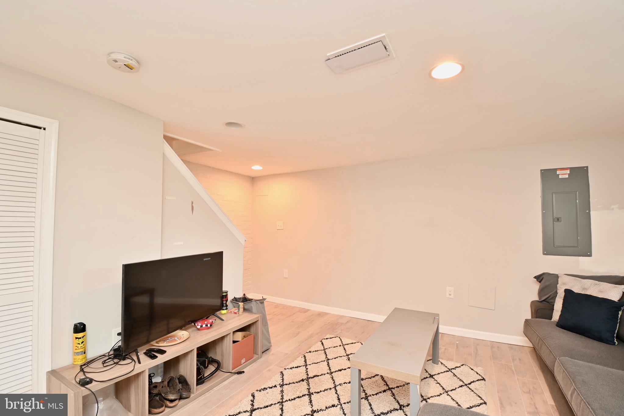 14 53rd Street Southeast Washington, DC 20019 - Photo 36 of 46 a living room with furniture and a flat screen tv