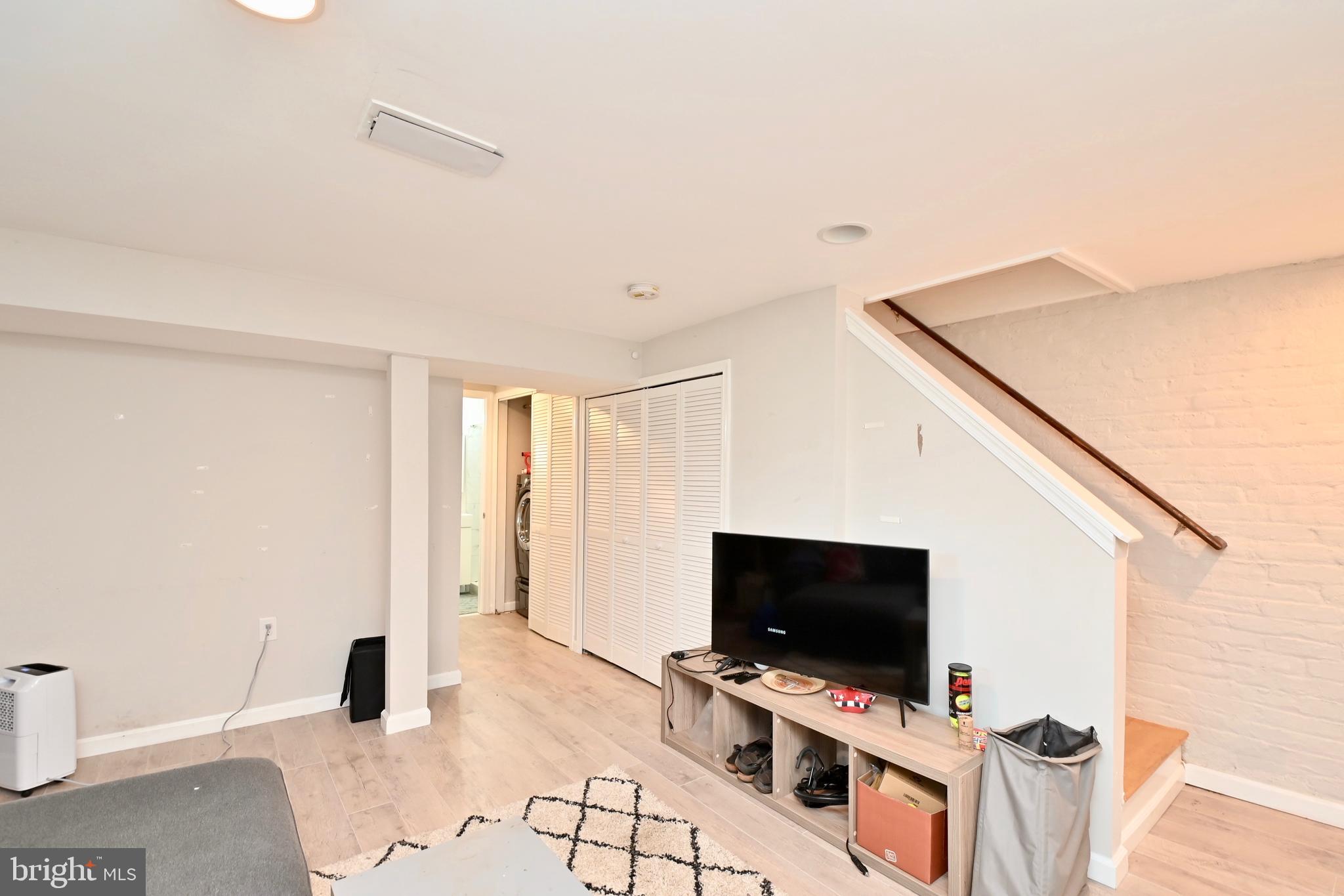 14 53rd Street Southeast Washington, DC 20019 - Photo 37 of 46 a living room with furniture and a flat screen tv