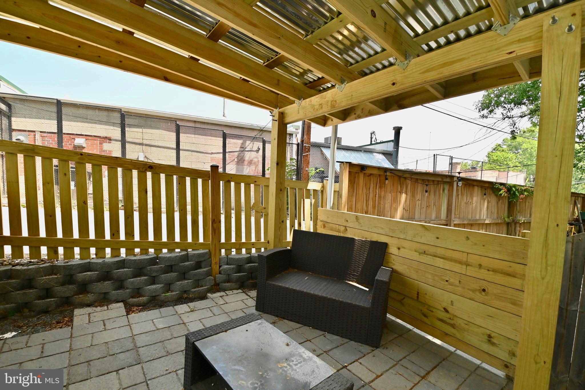 14 53rd Street Southeast Washington, DC 20019 - Photo 7 of 46 a porch with table and chairs