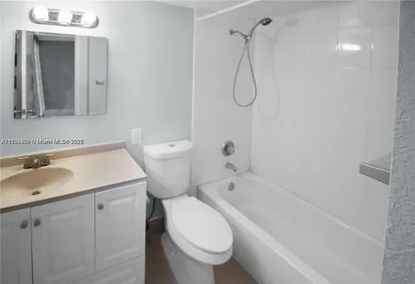 a bathroom with a sink a toilet and a bathtub