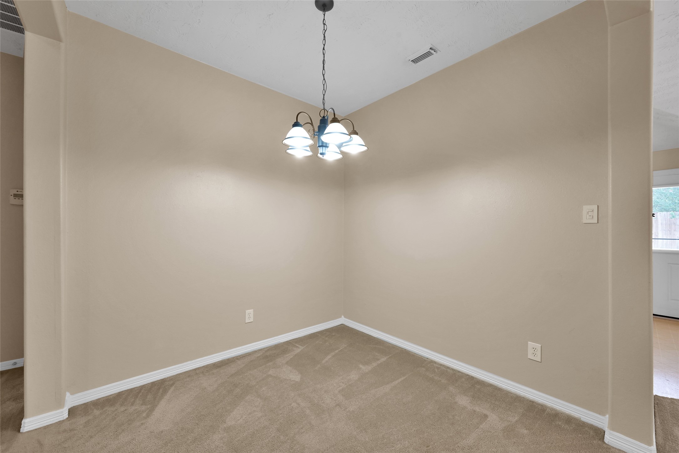 5046 Willow Point Drive Conroe, TX 77303 - Photo 17 of 44 a view of a chandelier in big room