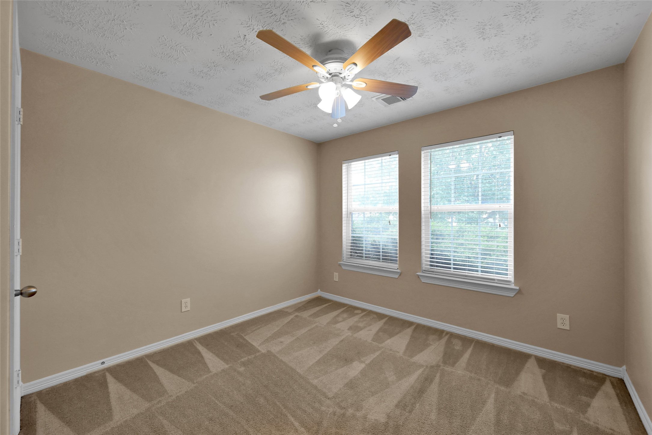 5046 Willow Point Drive Conroe, TX 77303 - Photo 32 of 44 a view of an empty room with a window