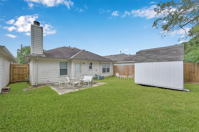 a front view of house with yard and outdoor seating