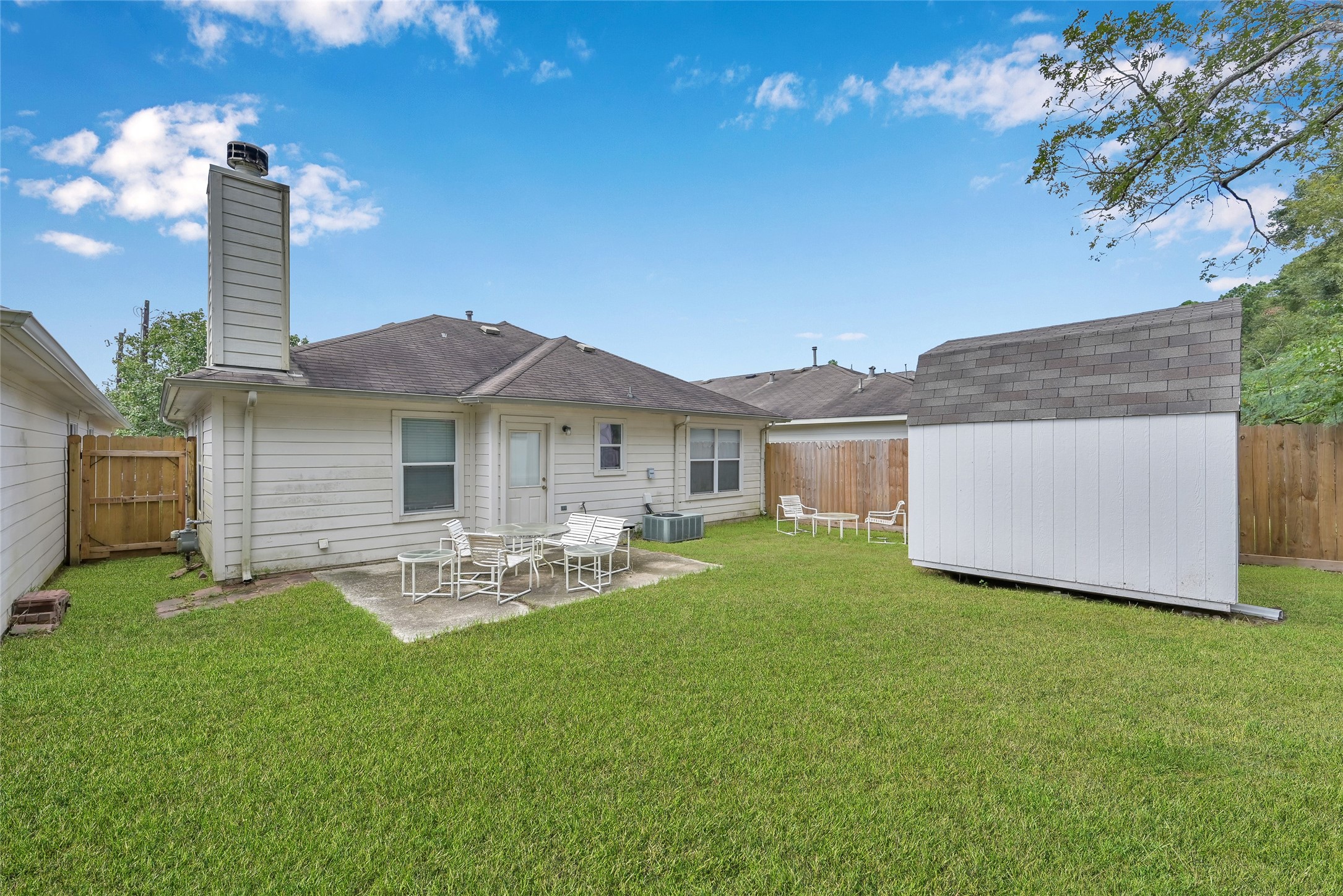 5046 Willow Point Drive Conroe, TX 77303 - Photo 38 of 44 a front view of house with yard and outdoor seating