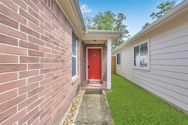 a view of a house with a small yard