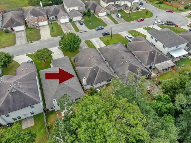 an aerial view of residential house with outdoor space and street view