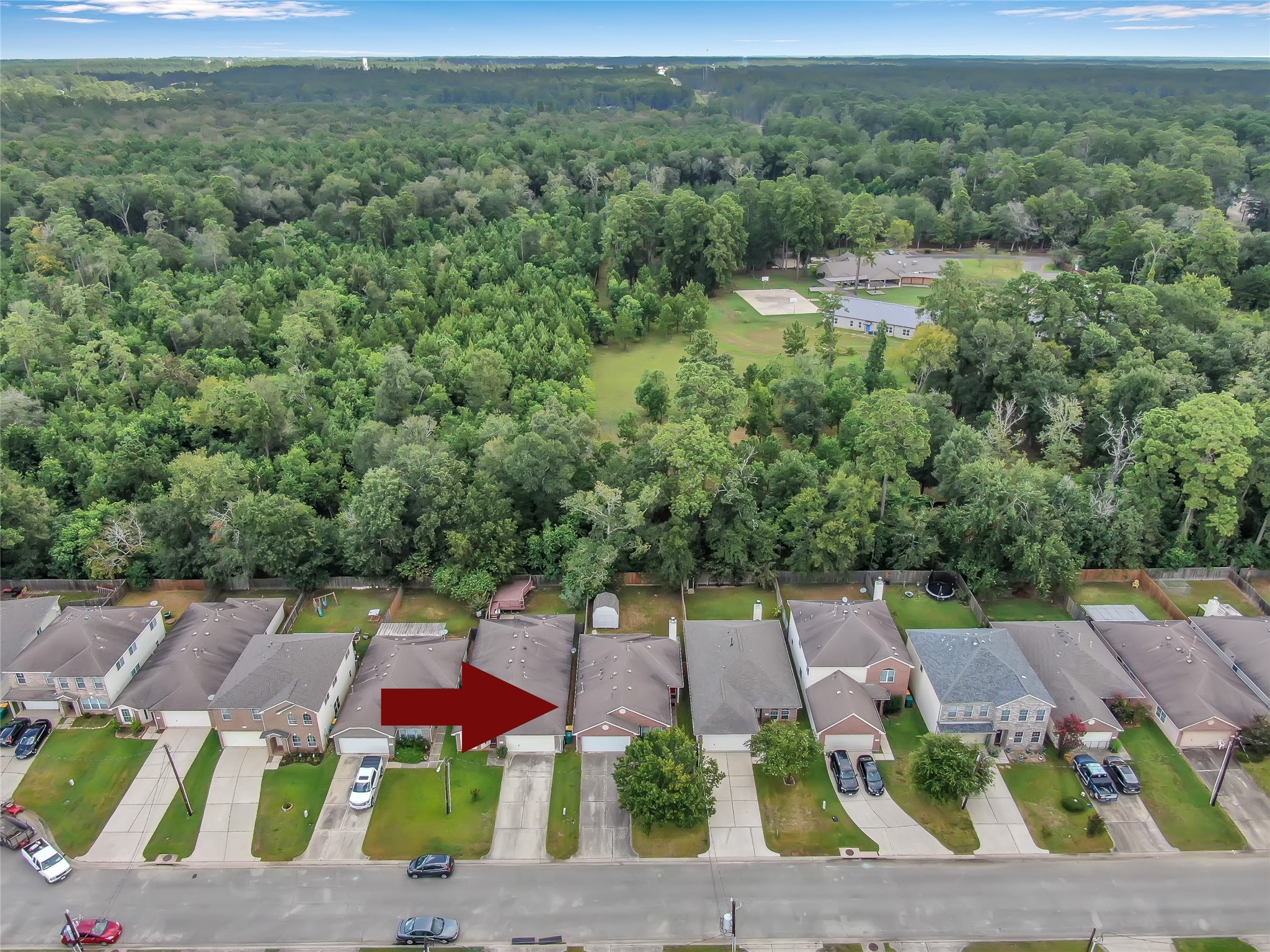 5046 Willow Point Drive Conroe, TX 77303 - Photo 44 of 44 an aerial view of a house with a yard