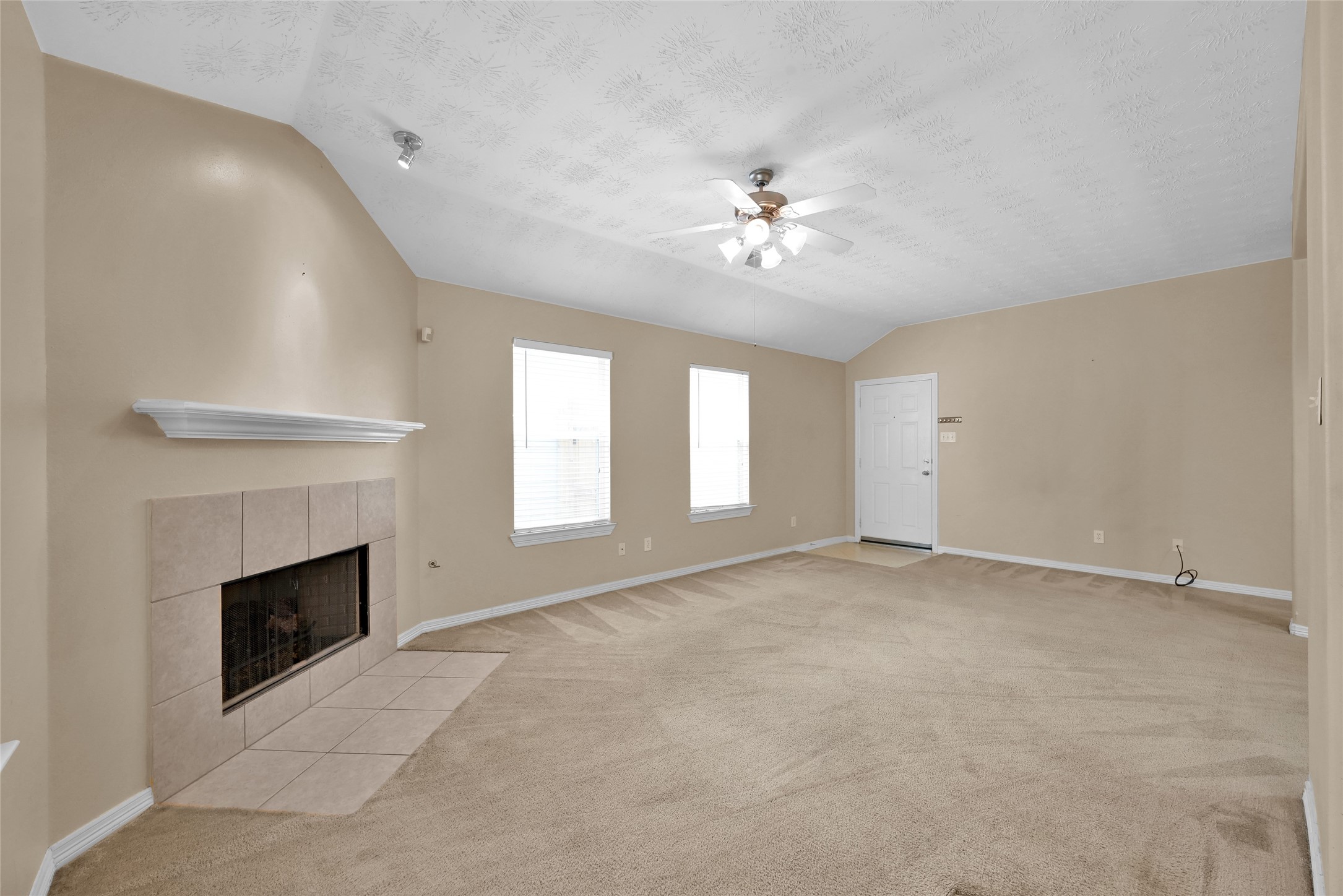 5046 Willow Point Drive Conroe, TX 77303 - Photo 9 of 44 a view of empty room with a fireplace