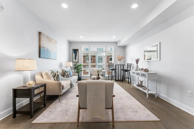 a living room with furniture and a table