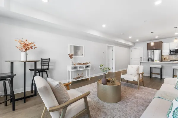 a living room with furniture and white walls