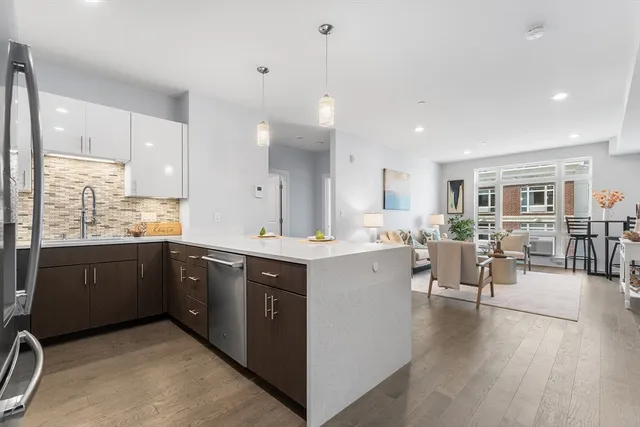 a large kitchen with lots of counter space and a sink