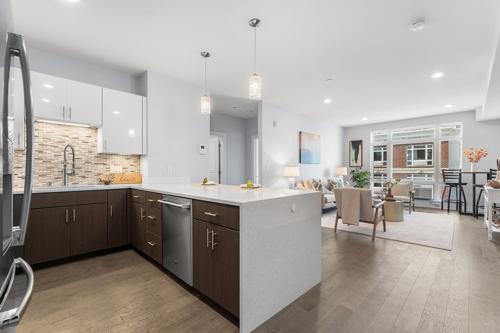 2 Cliveden Street, Unit 405E Quincy, MA 02169 - Photo 6 of 18 a large kitchen with lots of counter space and a sink