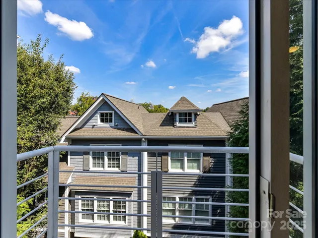 a view of entryway and gallery with wooden floor