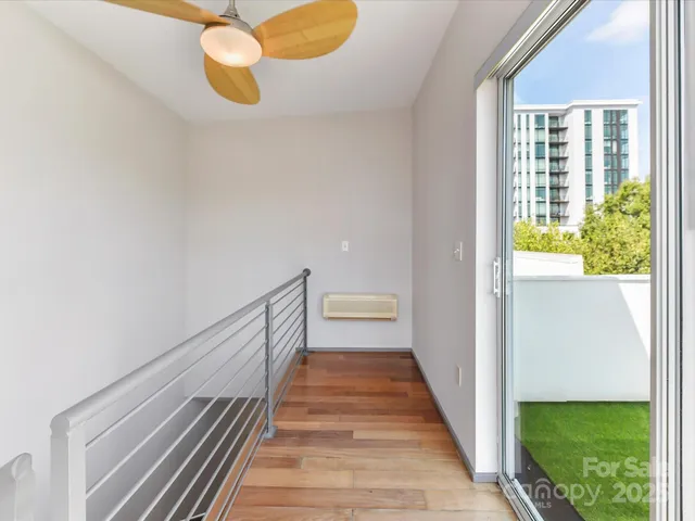 a view of a terrace with couches and a fire pit