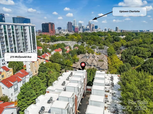 an aerial view of a house with a yard and garden