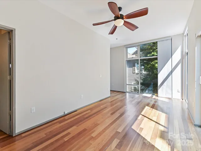 a view of a room with wooden floor and balcony