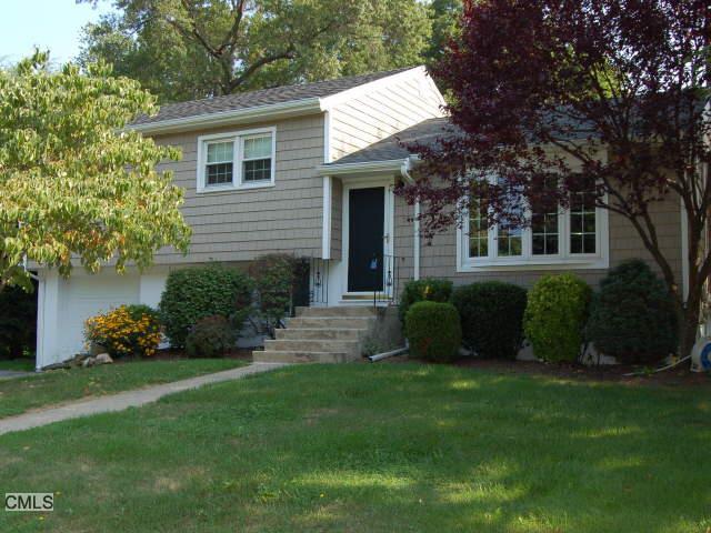266 Robin Lane Fairfield, CT 06824 - Photo 1 of 1 a view of a house with a yard and a garden
