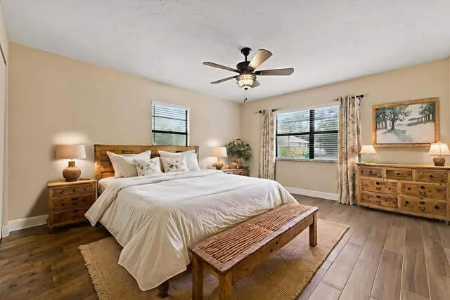 a bed room with a bed and a window