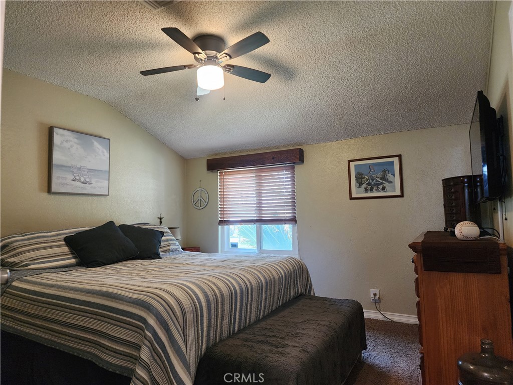 7450 Thunderbird Lane Stanton, CA 90680 - Photo 12 of 31 a bedroom with a bed and a chandelier