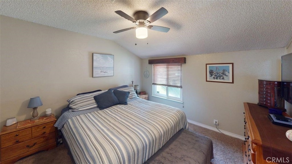 7450 Thunderbird Lane Stanton, CA 90680 - Photo 13 of 31 a bedroom with a bed and a chandelier