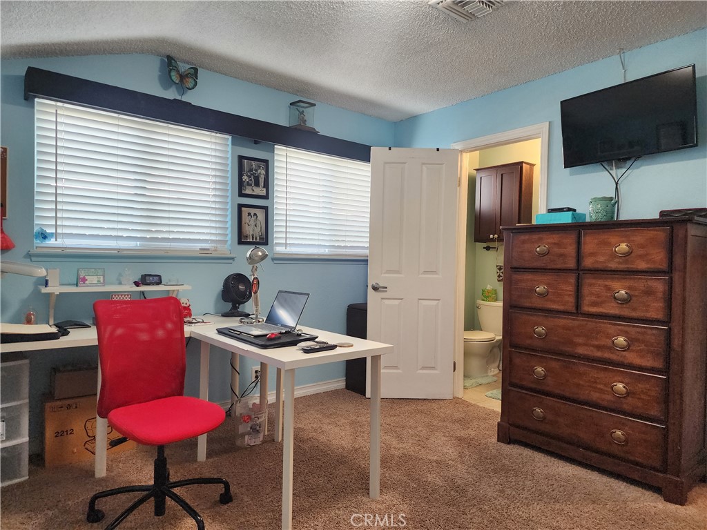 7450 Thunderbird Lane Stanton, CA 90680 - Photo 19 of 31 a room with furniture cabinets and a window