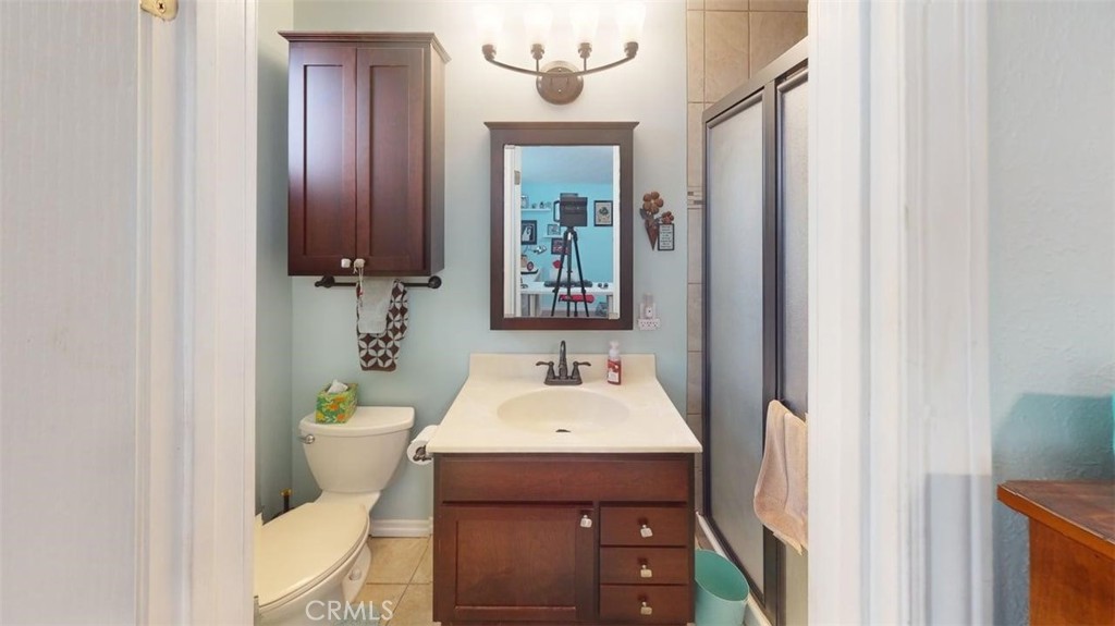 7450 Thunderbird Lane Stanton, CA 90680 - Photo 20 of 31 a bathroom with a sink and a mirror
