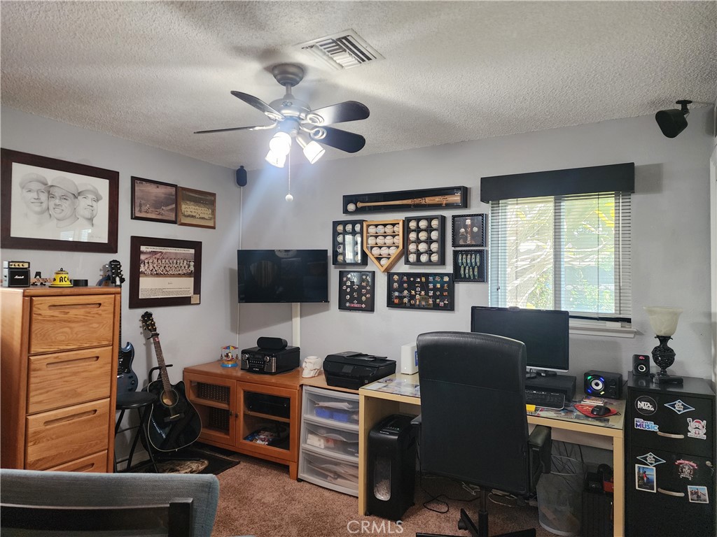 7450 Thunderbird Lane Stanton, CA 90680 - Photo 21 of 31 a view of a livingroom with workspace and a window