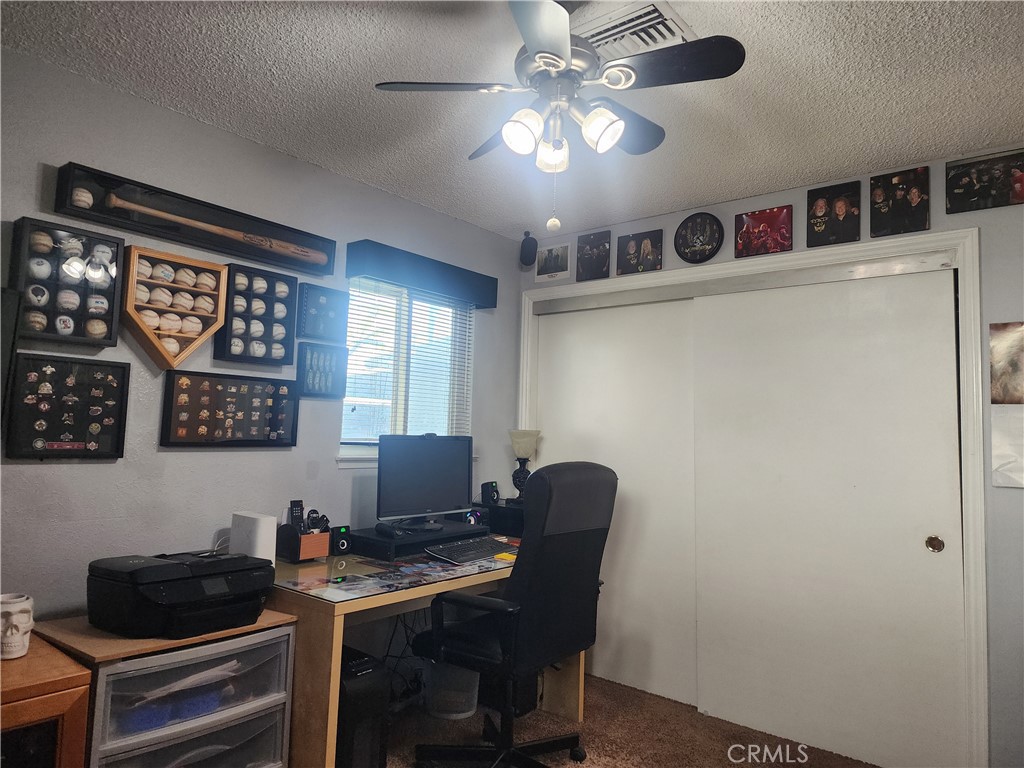 7450 Thunderbird Lane Stanton, CA 90680 - Photo 24 of 31 a view of a workspace with furniture and a window