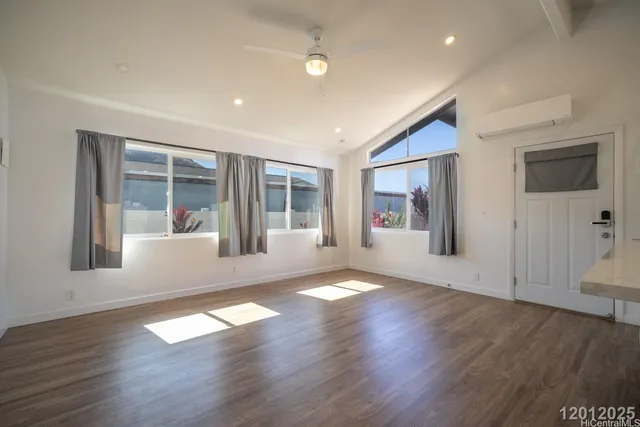 a view of livingroom with furniture wooden floor and window
