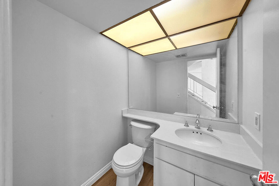 1333 Valley View Road, Unit 25 Glendale, CA 91202 - Photo 17 of 27 a bathroom with a sink toilet and mirror