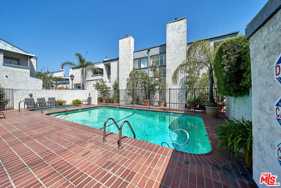 1333 Valley View Road, Unit 25 Glendale, CA 91202 - Photo 2 of 27 a view of a swimming pool with a patio