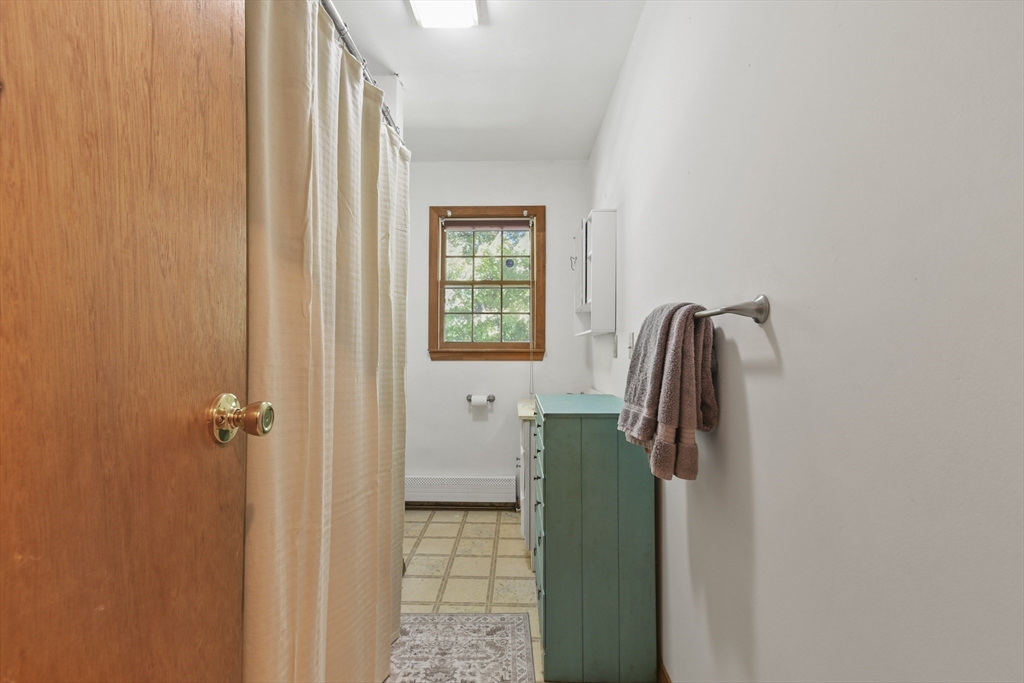 29 Murphy Place Pittsfield, MA 01201 - Photo 17 of 26 a bathroom with a shower and a mirror
