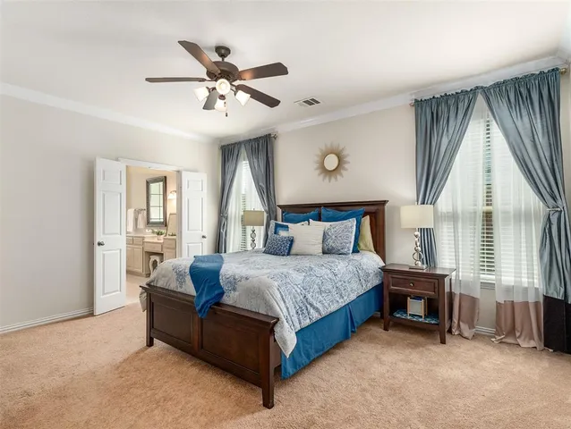 a bedroom with a bed and cabinet