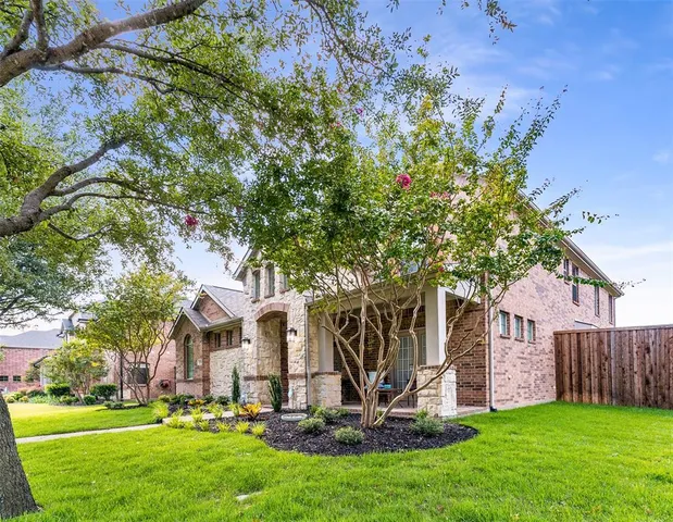 a view of a patio with table and chairs and potted plants
