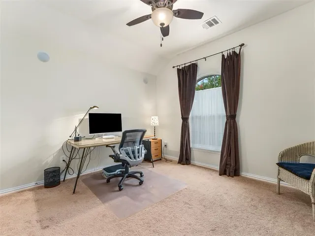 a view of a workspace with furniture