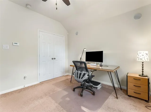 a view of room with window and ceiling fan