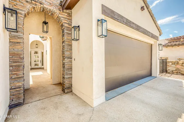 a living room with fireplace furniture and a large window